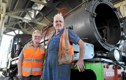 Southern Downs Steam Railway president Christine Ford, with steam fitter John Brady, with the newly-fixed steam train.